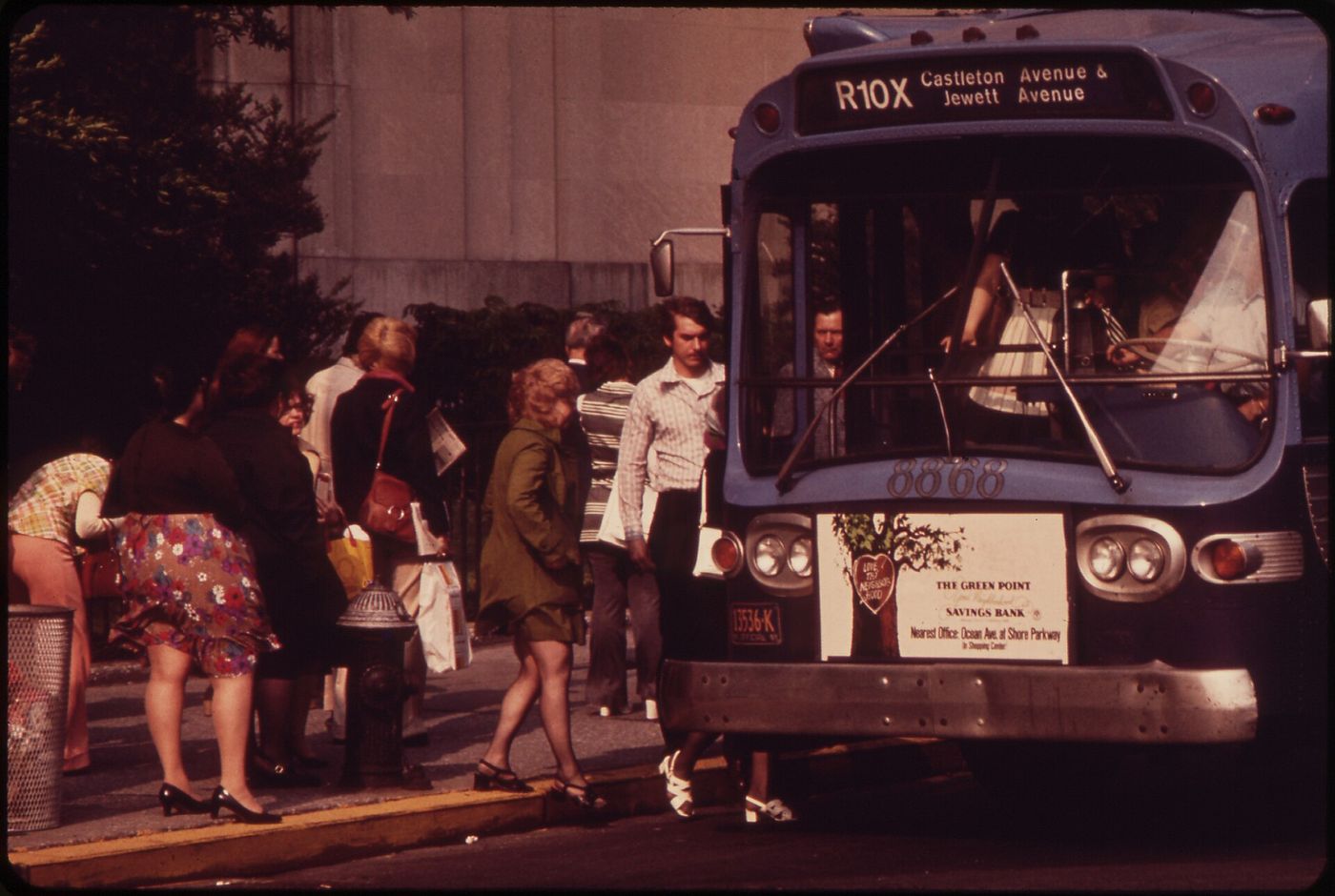 Passengers boarding a bus in the financial district of Lower Manhattan, 1973